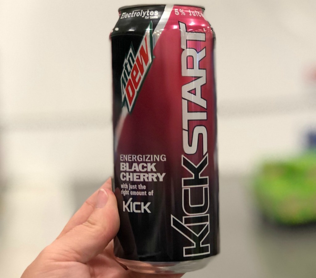 Mountain Dew Kickstart Energy Drink in Black Cherry in hand in store