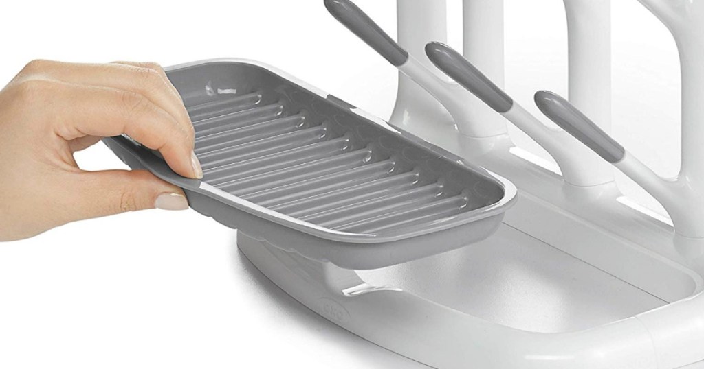 woman holding part of OXO drying rack