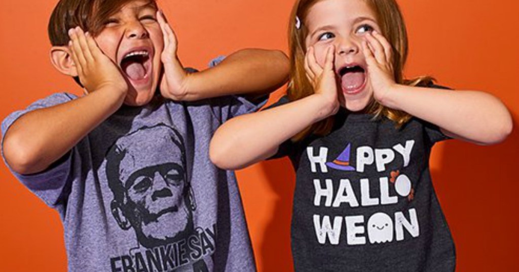 Boy and Girl wearing Halloween themed tees and making faces!