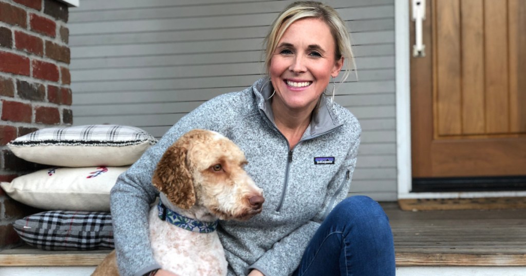 woman wearing patagonia sweater with dog