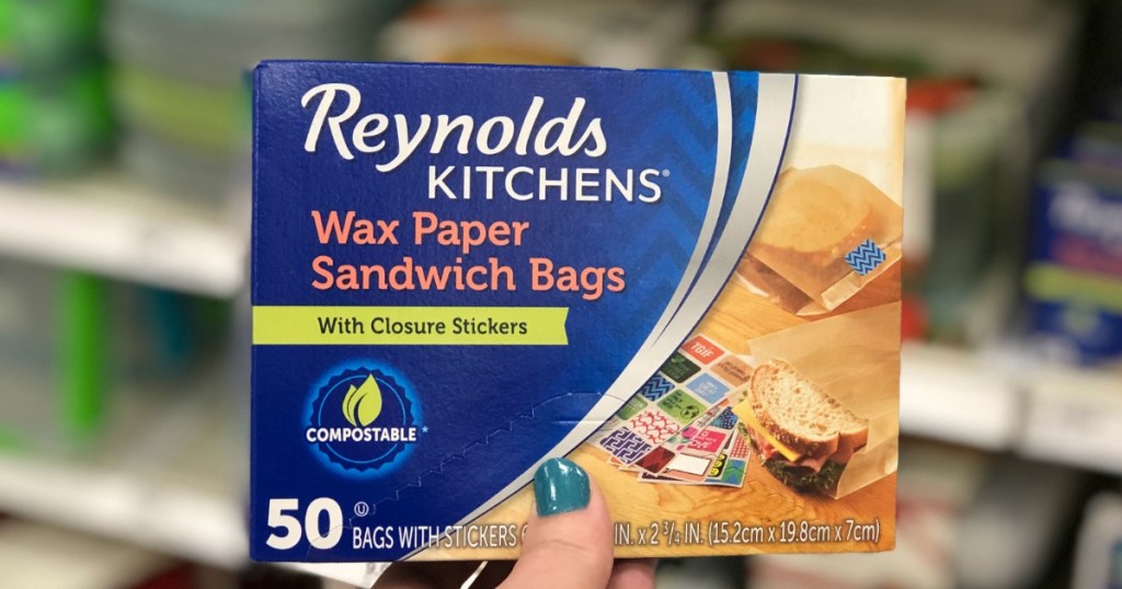 hand holding up Reynolds Wax Paper Sandwich Bags in box