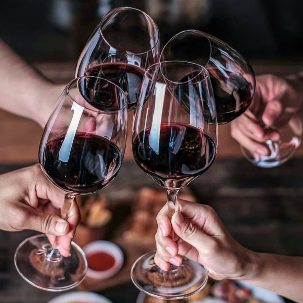 Four wine glasses with red wine 