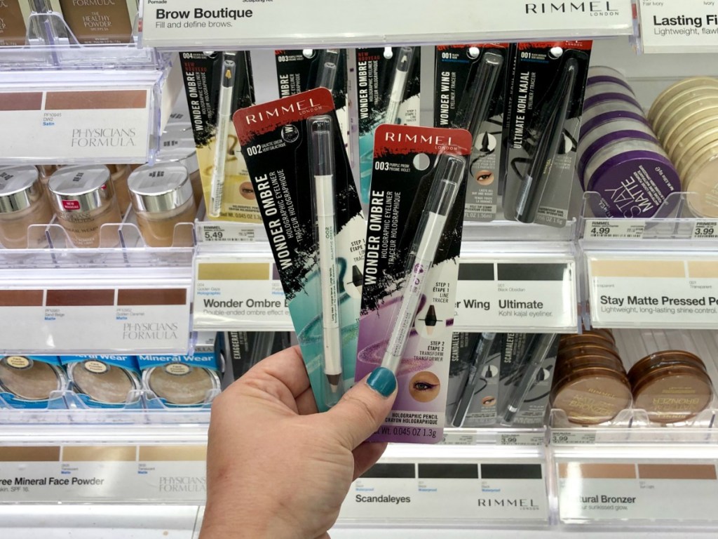 Rimmel Wonder Ombre liners held in hand in front of Target Cosmetics wall