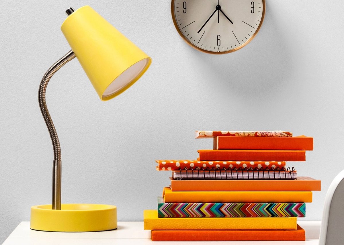 desk with books and lamp