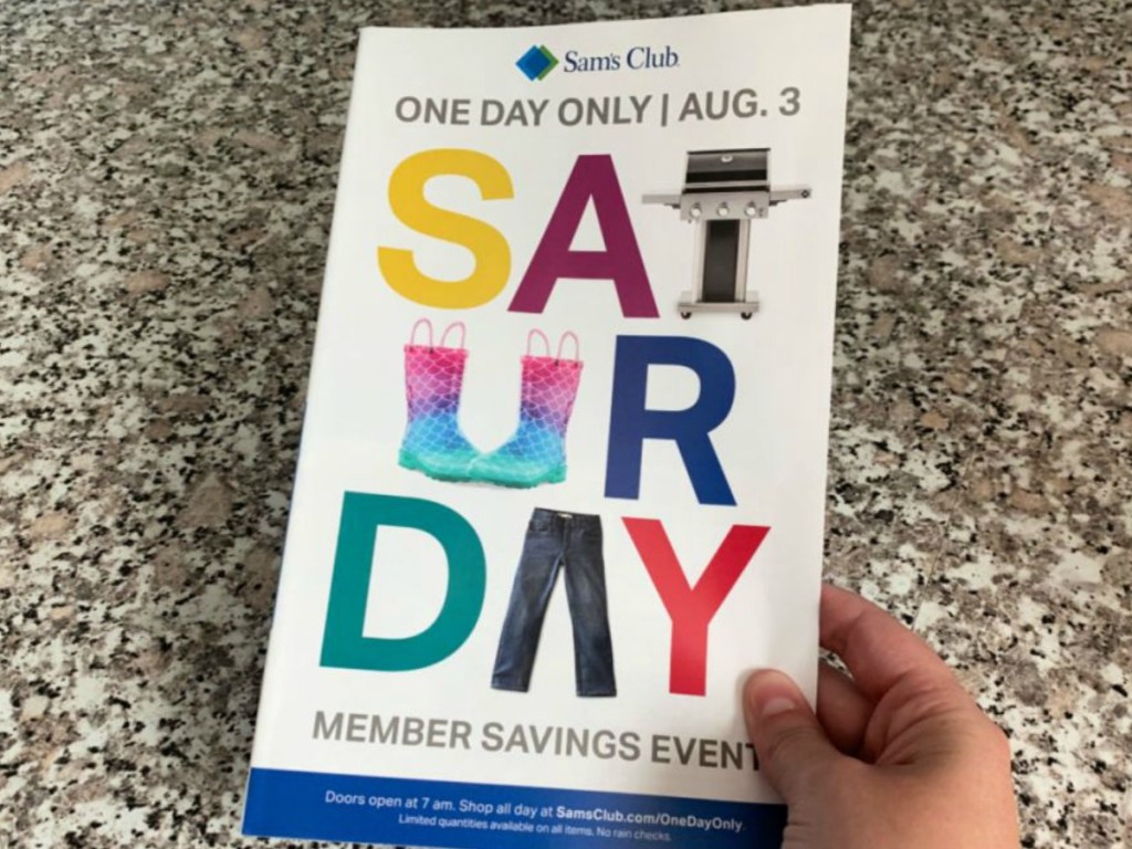 hand holding flyer with words for a store ad