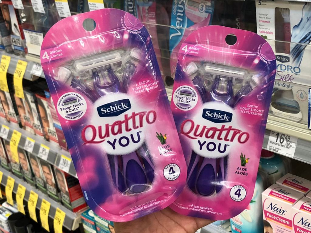 hand holding two schick quattro you