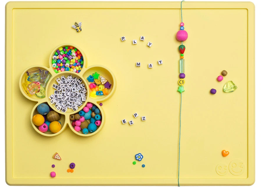 EzpZ flower playmat with beads on it