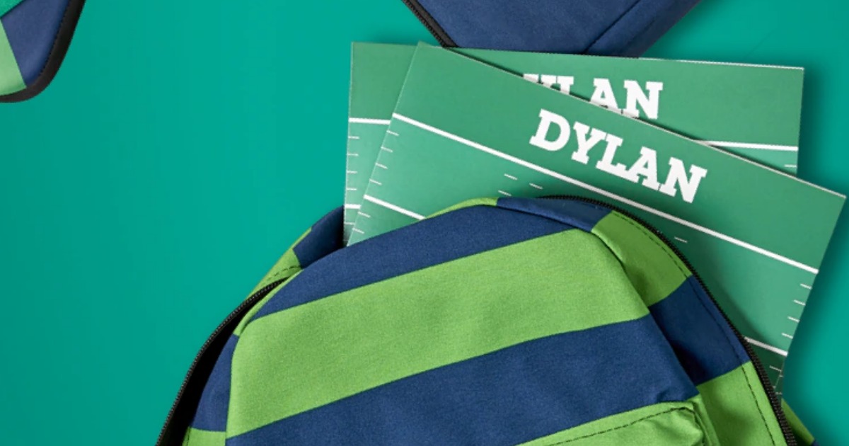 folders with the name Dylan on them coming out of a backpack