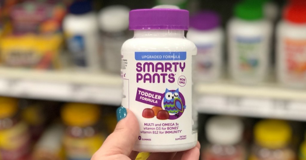 Smarty Pants Toddler Vitamins in hand in aisle of store