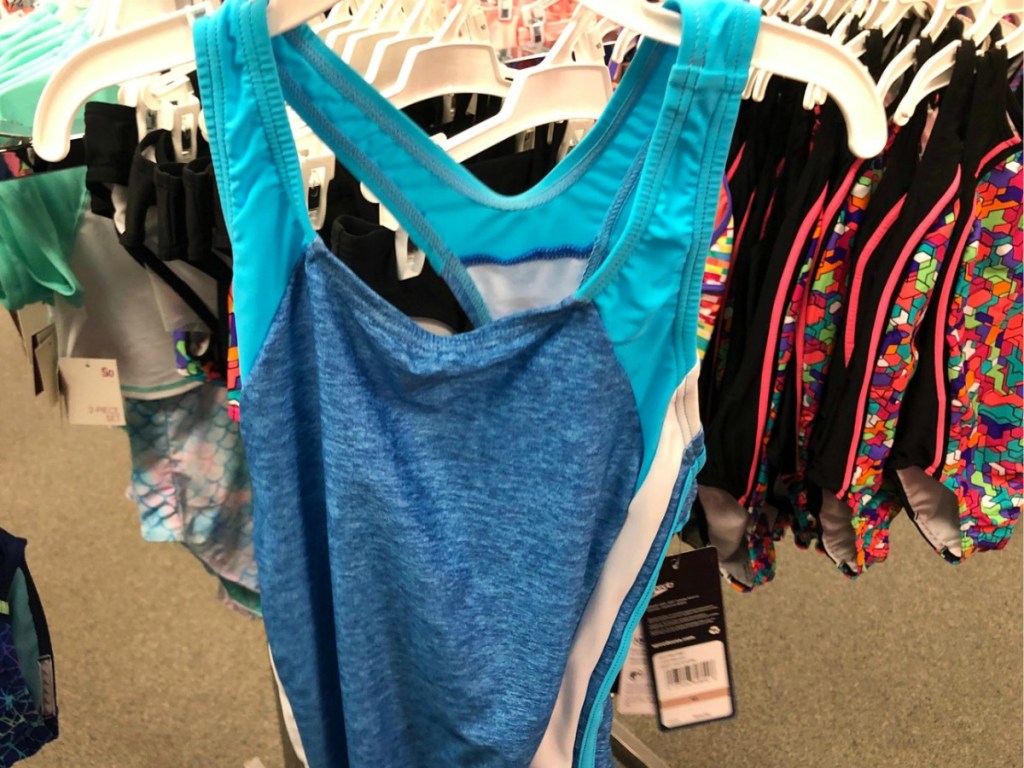 girl's solid speedo swimsuit on hanger