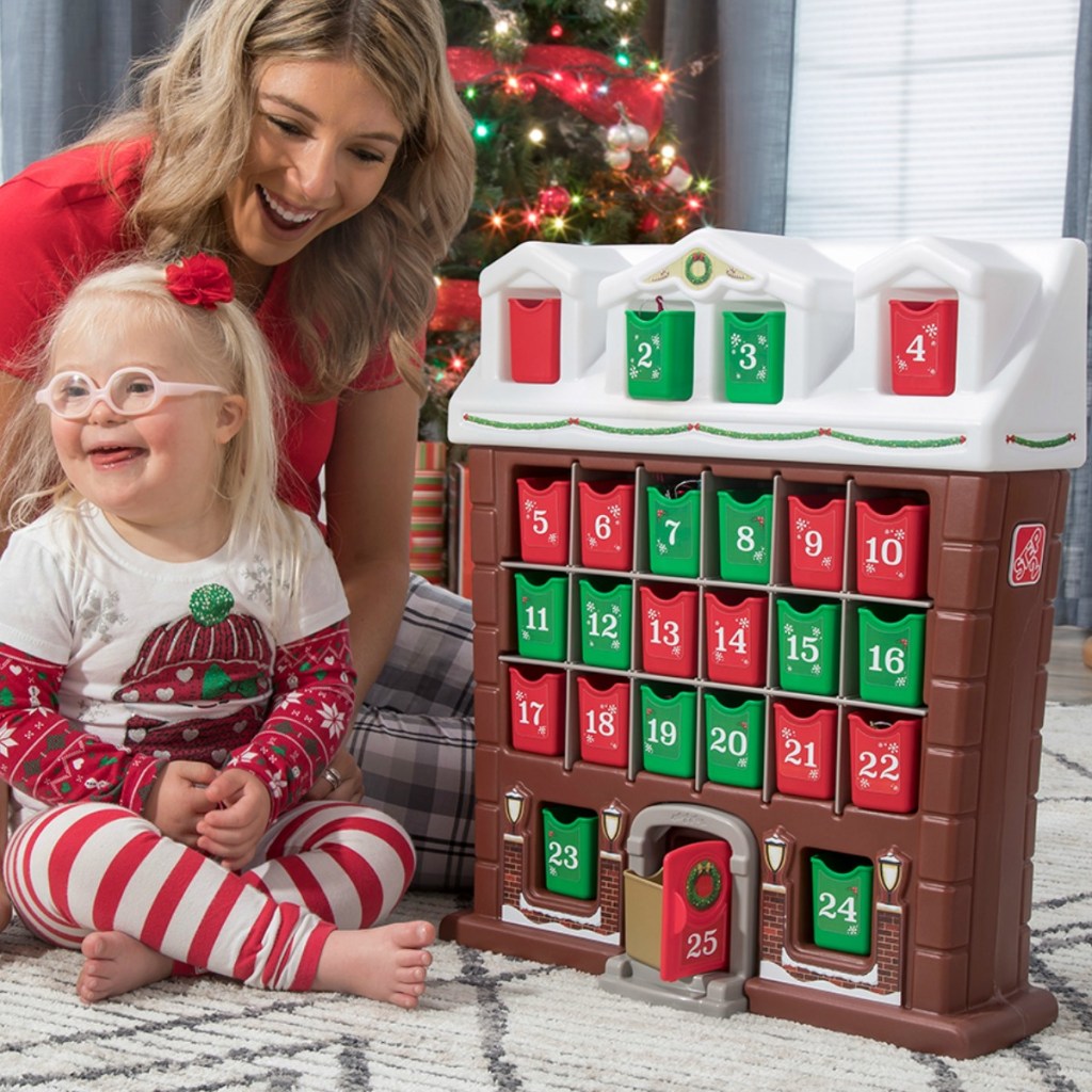 Mom and daughter playing with Step2 brand play house advent calendar