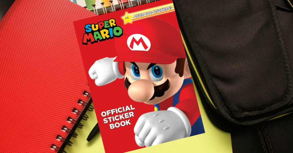 Official Mario Brother Sticker Book on desk with notebooks