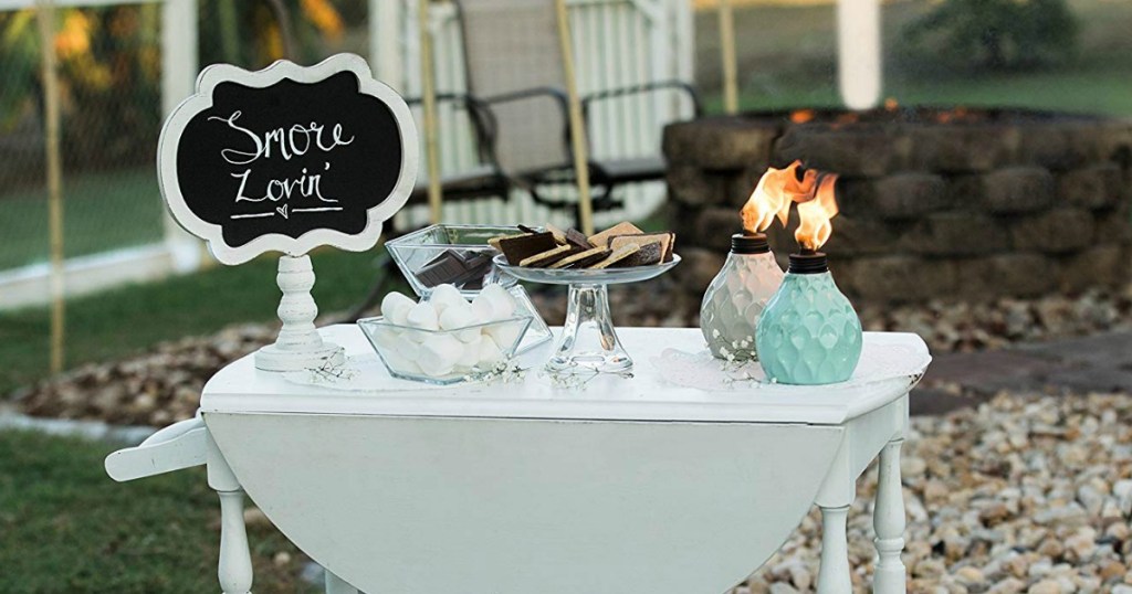 Tiki Torch Candles on cute serving table with S'mores