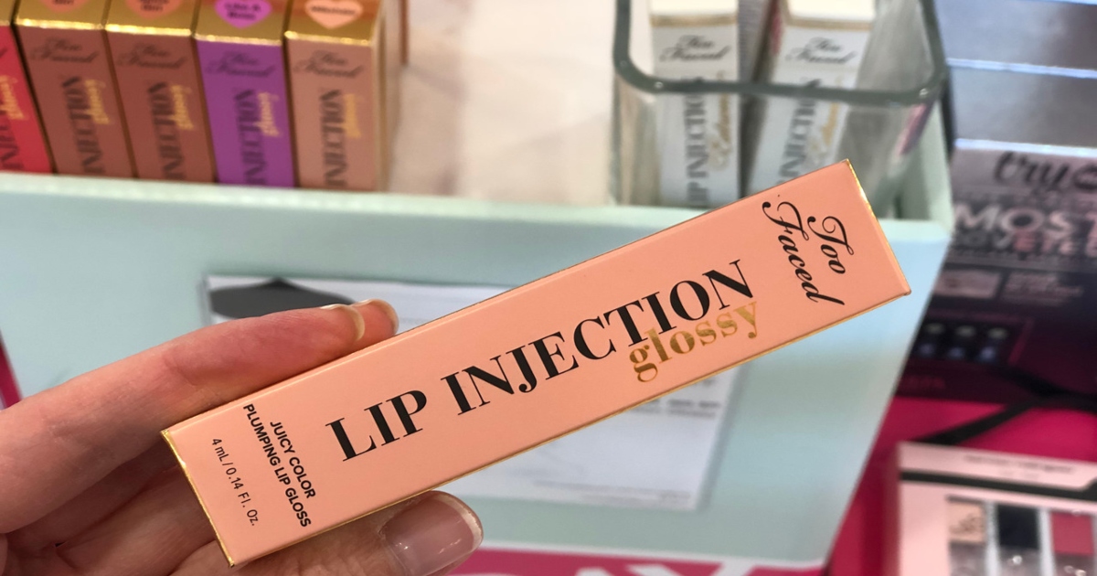 hand holding Too Faced Lip Injection