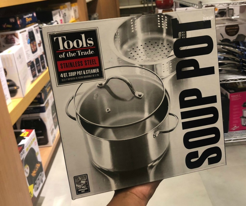 Soup pot with steamer attachment in box in hand in store