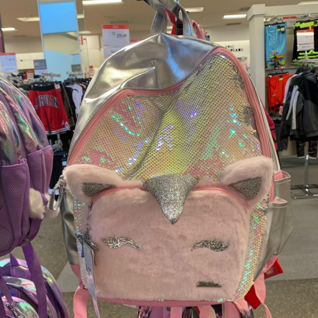 Unicorn themed fuzzy backpack from Macy's on store rack