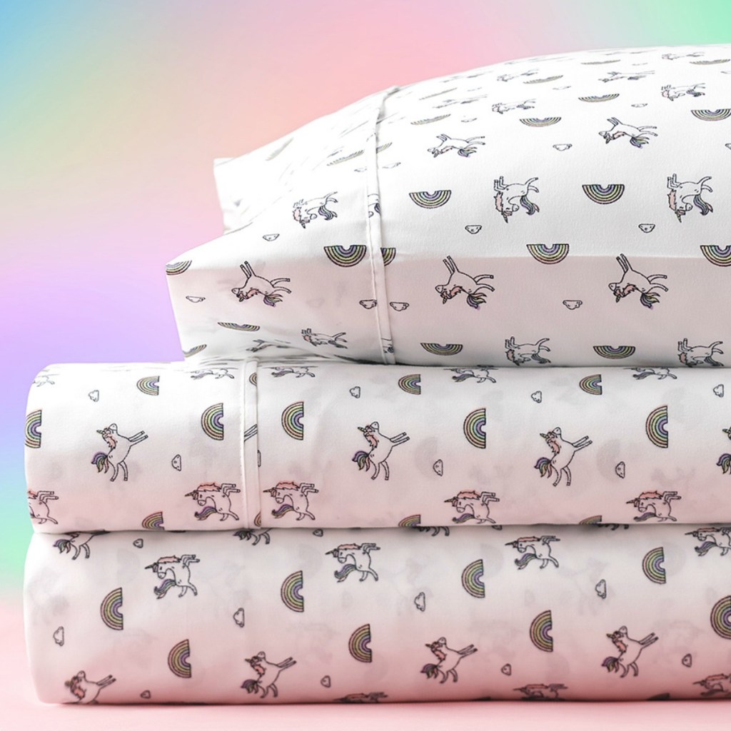 Unicorn themed kids sheets in stack with matching pillow case.