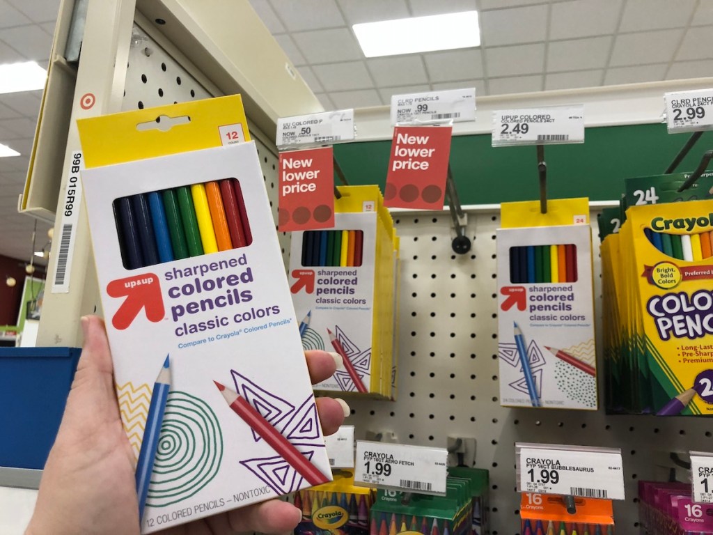 hand holding colored pencils at Target