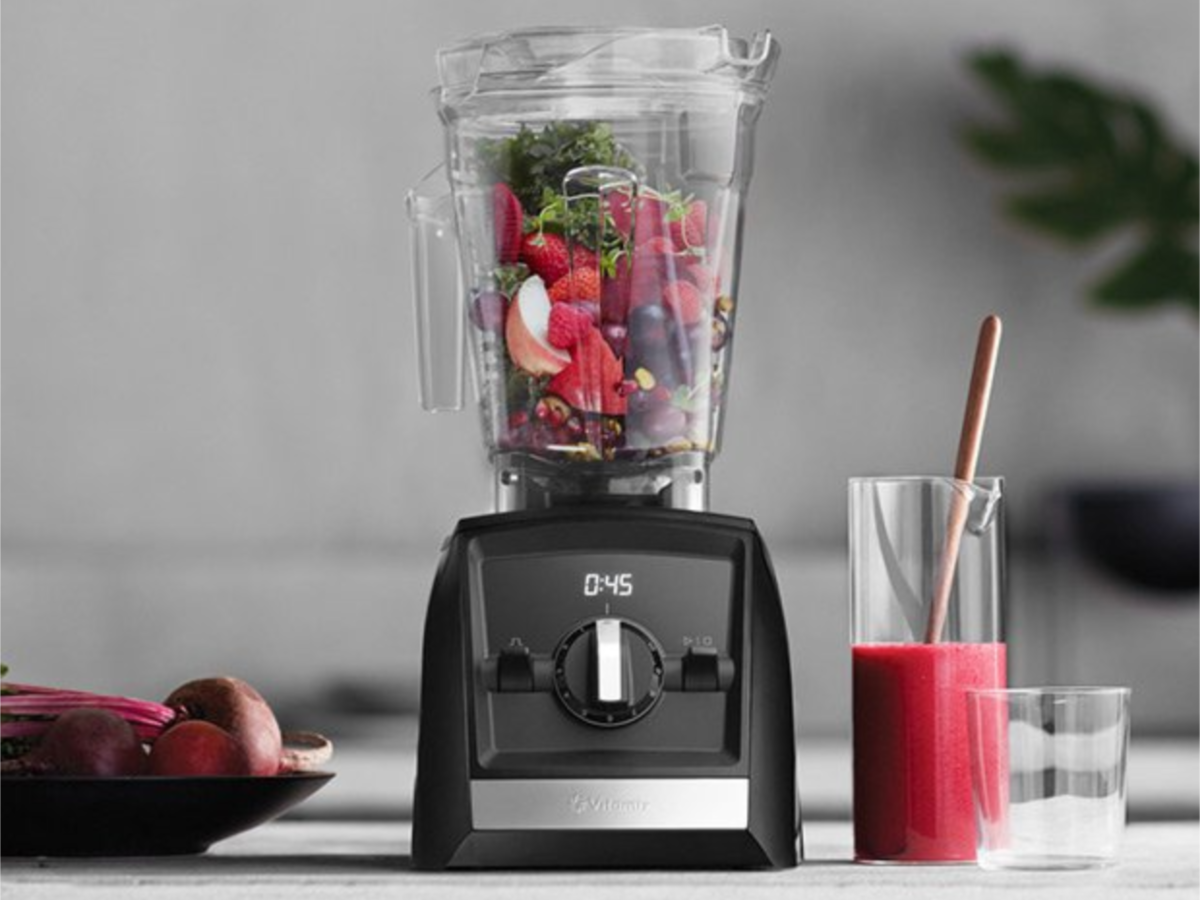 Vitamix A2300 Ascent Series Blender on counter with berries and smoothie in cup