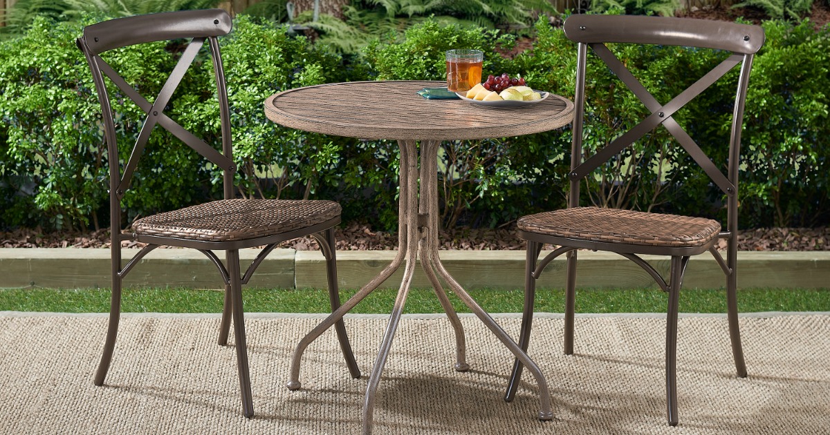 Wicker Camrose Chairs around small outdoor bistro table