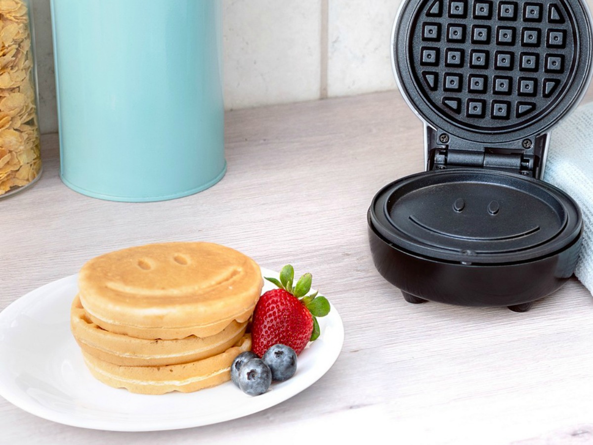 waffles on plate with happy faces on counter