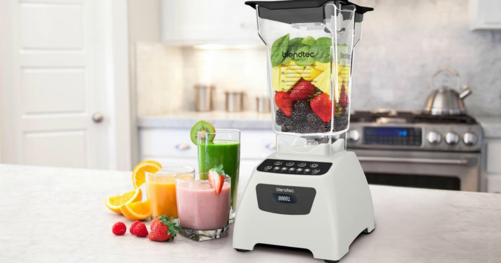 white blendtec wildside blender on counter next to smoothies