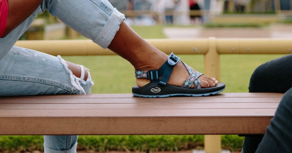 woman wearing chaco zcloud2 on bench