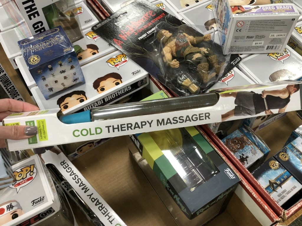 hand holding therapy massager by store display