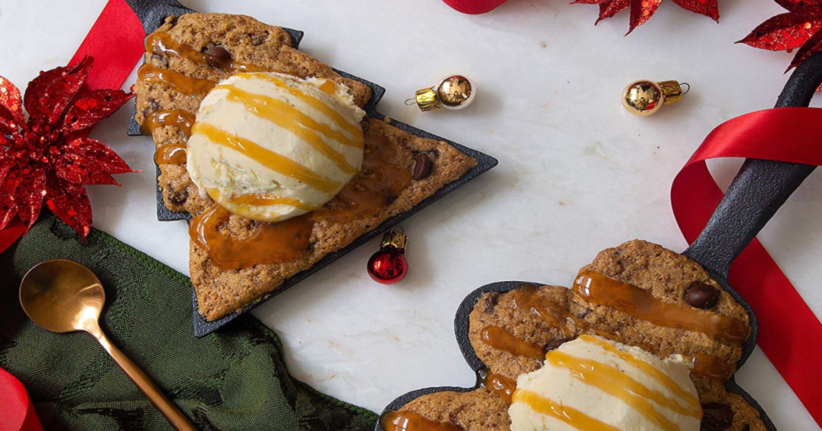 holiday-shaped chocolate chip cookies in cast iron pans topped with ice cream & sauce
