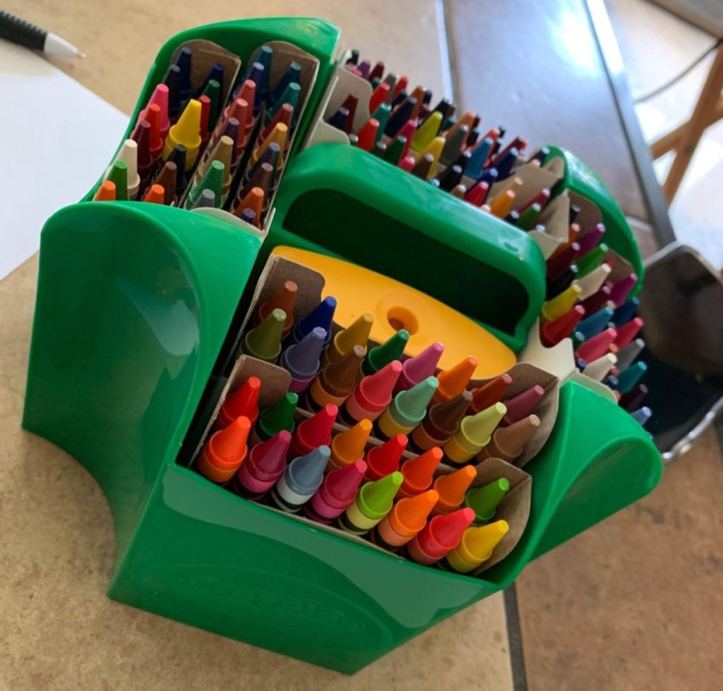 green caddy holding crayons