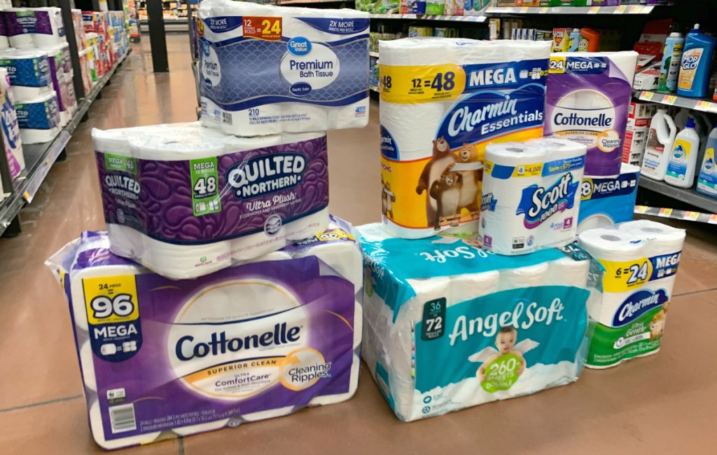 different brands of toilet paper on ground
