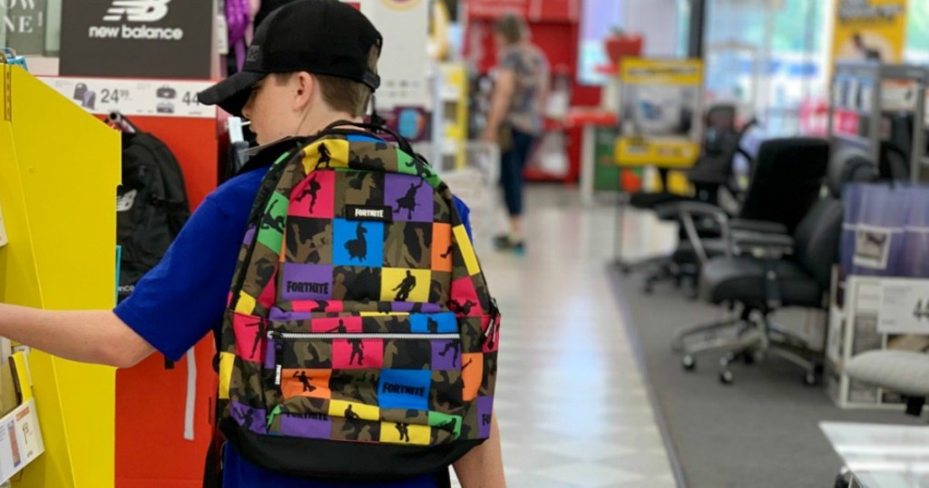 boy wearing a fortnite backpack in-store