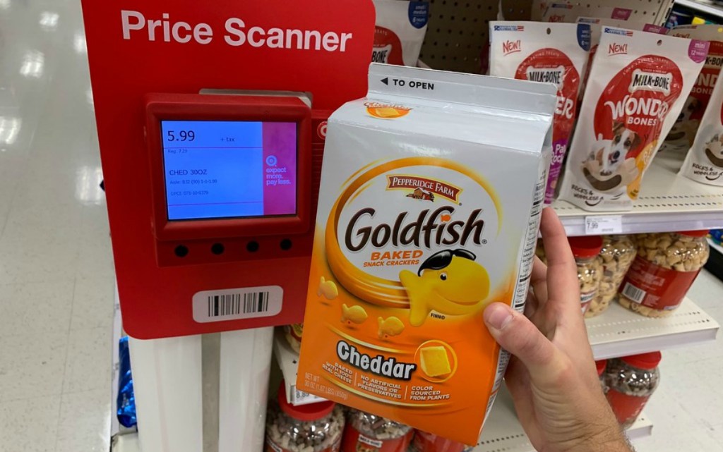 carton of Goldfish crackers held next to a Target price scanner