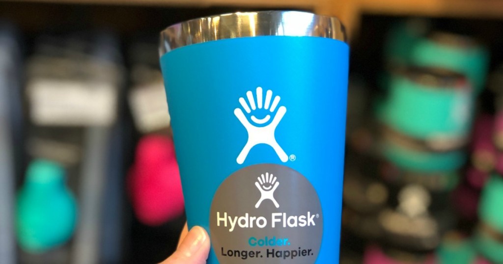 blue hydro flask tumbler held in hand