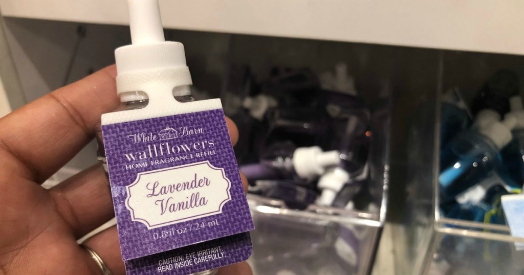 hand holding lavender vanilla wallflower refills