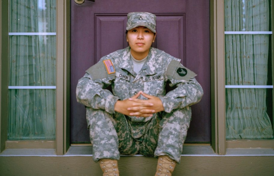woman sitting on porch wearing military army uniform