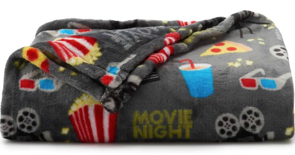 grey blanket with pictures of popcorn and soda on it