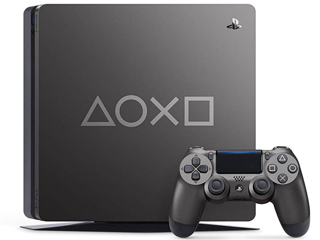 playstation console with controller on white background