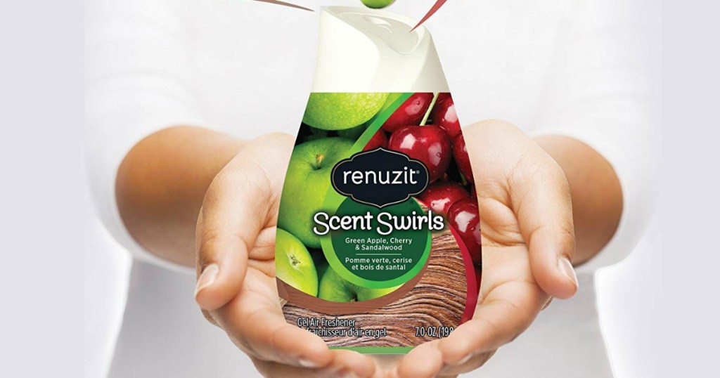 woman holding the renuzit scent swirls in her hands