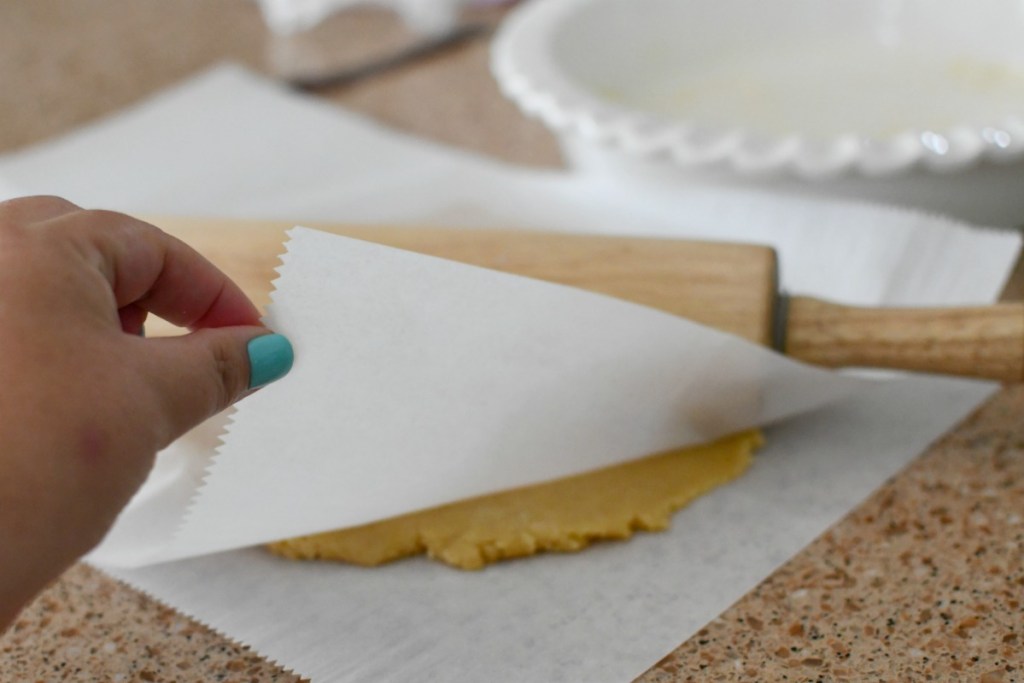 rolling out a crust with parchment paper