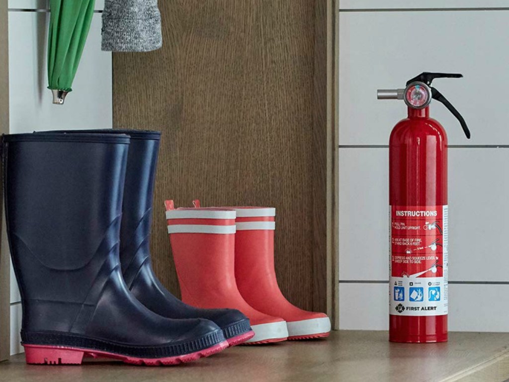 fire extinguisher and boots on counter