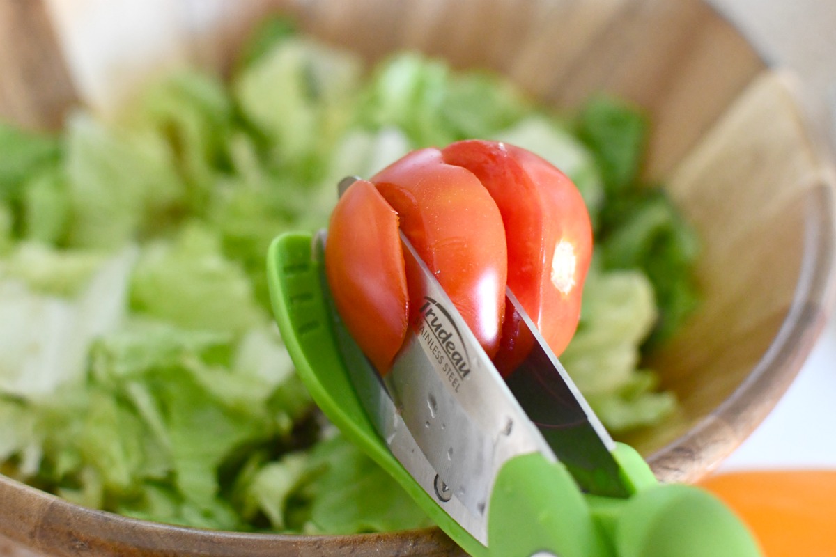 slicing tomato with chop and toss salad