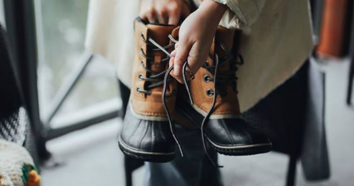 women holding sorel boots 