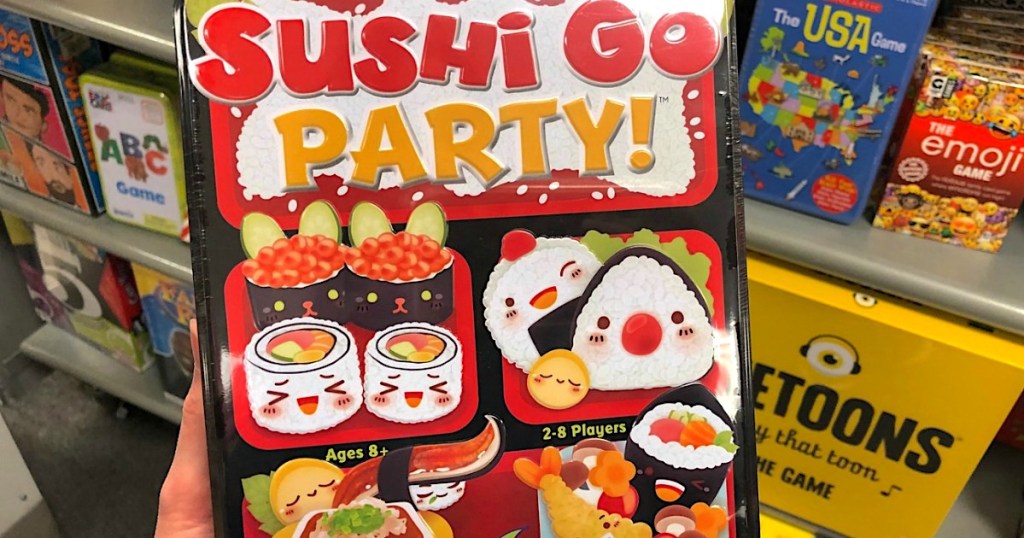 holding Sushi Go Party game 