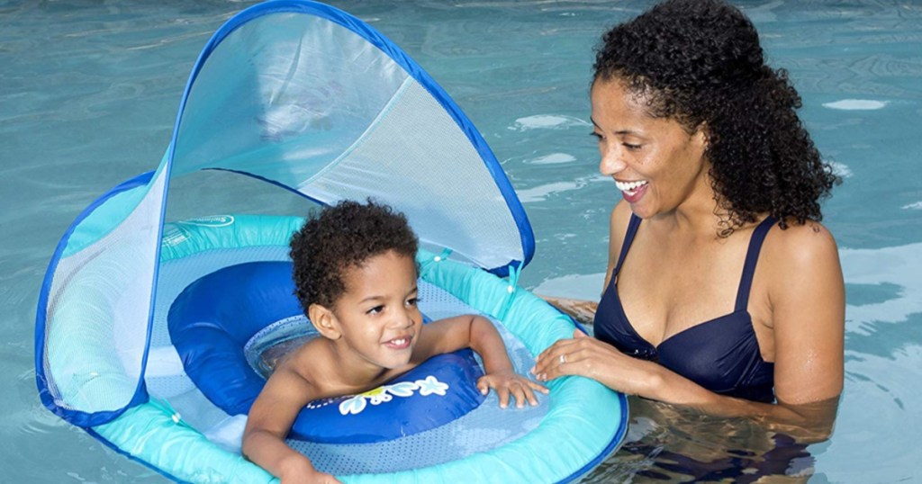 Mom with son in baby swimways canopy in pool