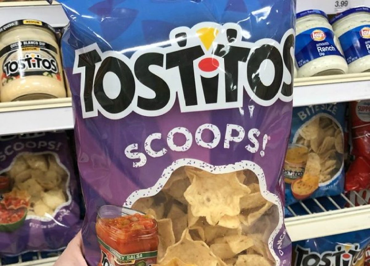 hand holding tostitos chips