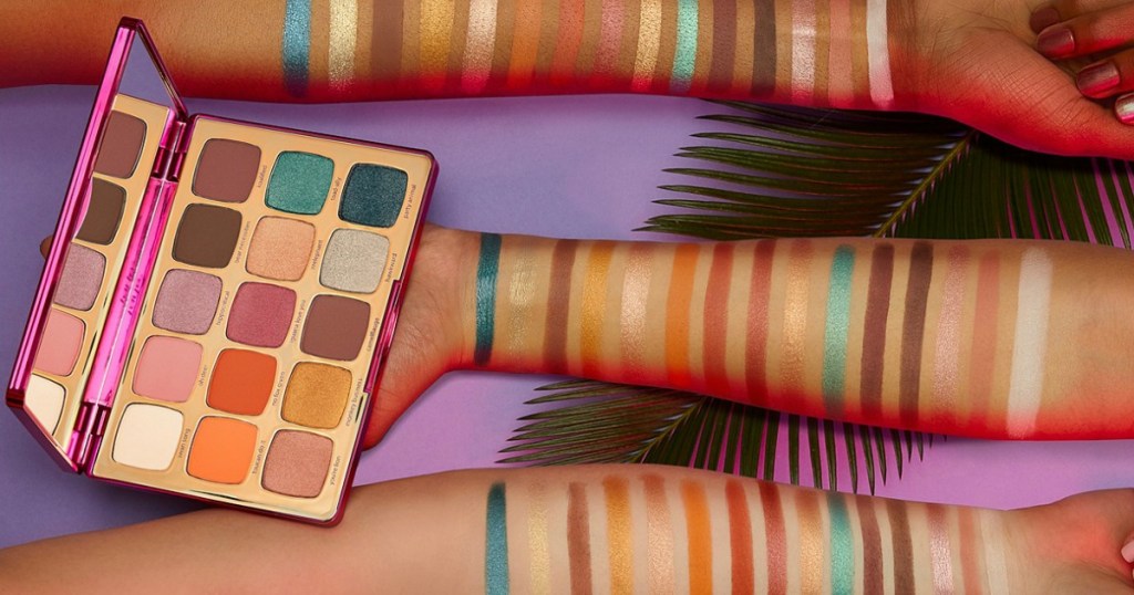 arms with makeup on them and tarte palette
