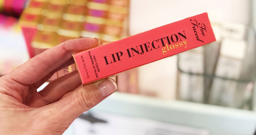 hand holding Too Faced Lip injections Glossy