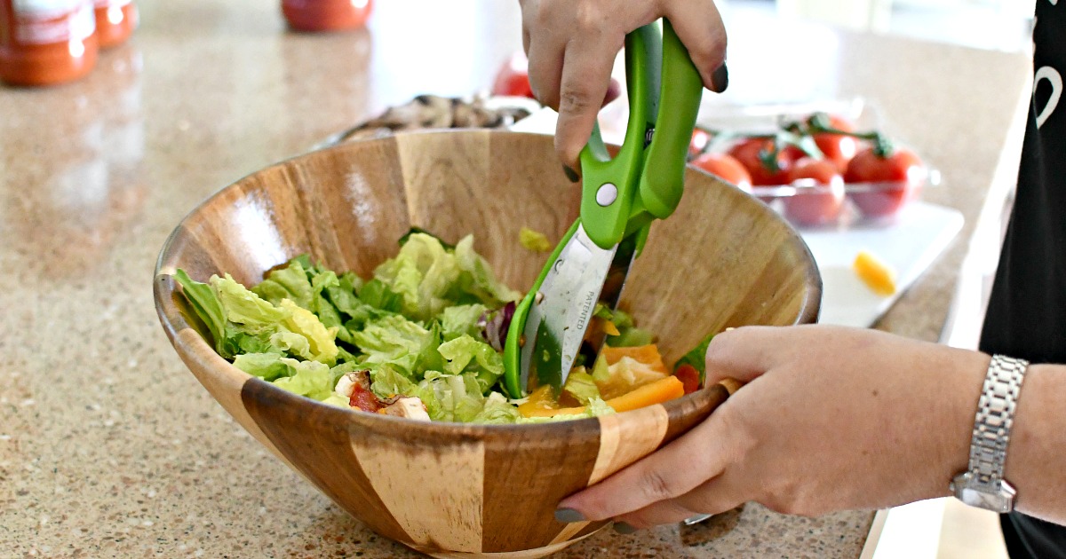 using toss and chop salad scissors in a bowl