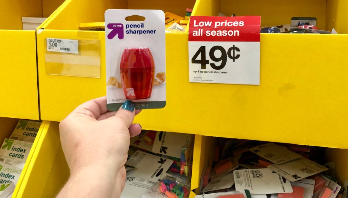 holding up pencil sharpener next to price tag